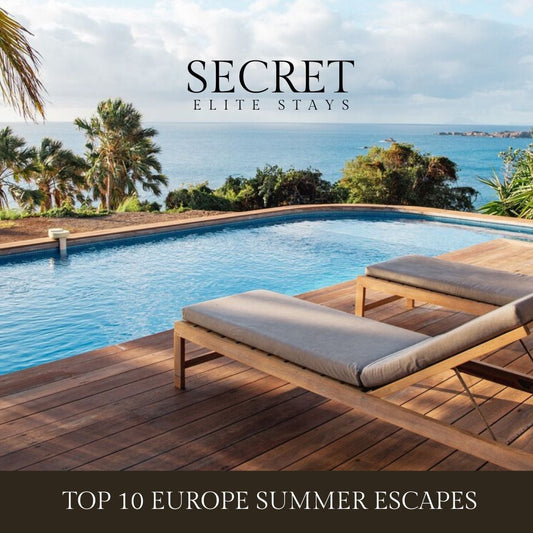 Pool area with lounge chairs and scenic ocean view, featuring 'Secret Elite Stays' branding.